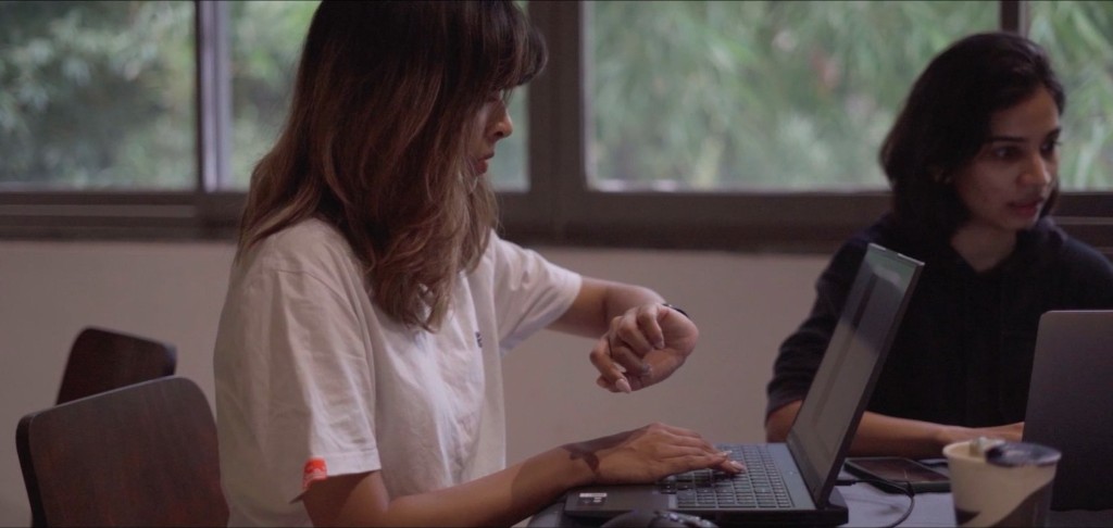 Working at a laptop at an event table